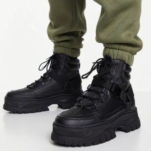 Lace-up Boots in black faux leather with chunky sole and strap